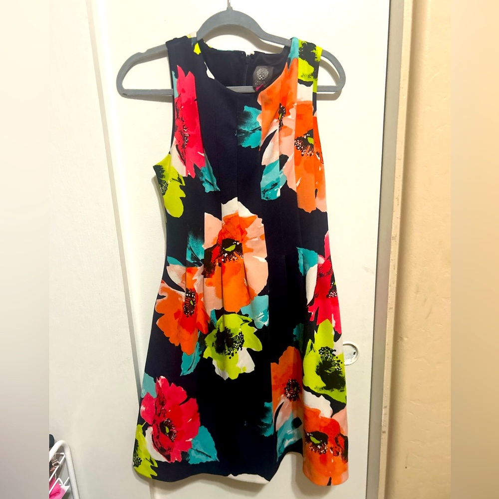 This is a Vince Camuto dress. I love the pattern of and color. Hardly worn